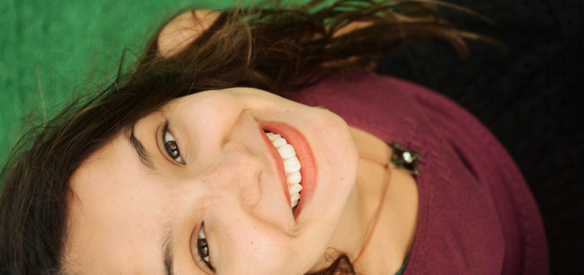Brunette Adolescent Female Smiling with Beautiful Teeth